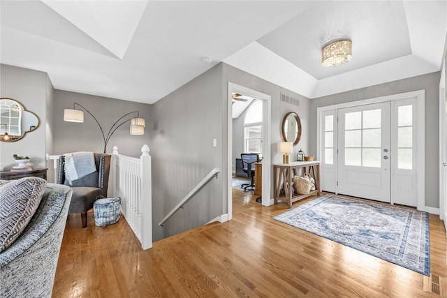 1355 Red Star Rd, Tipton, IA 52772 - entrance foyer with wood finished floors, a tray ceiling, and baseboards