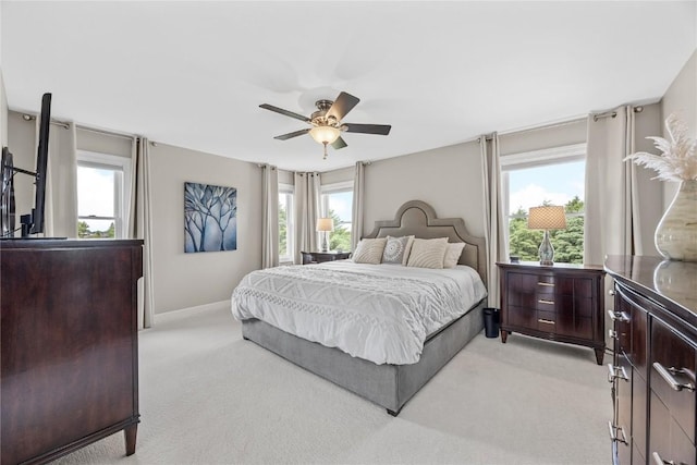 1355 Red Star Rd, Tipton, IA 52772 - bedroom featuring light colored carpet, a ceiling fan, and baseboards