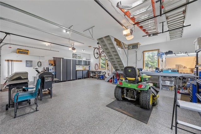 1355 Red Star Rd, Tipton, IA 52772 - garage featuring a garage door opener and electric panel