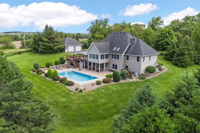 1355 Red Star Rd, Tipton, IA 52772 - back of house with stairs, a deck, a yard, a patio area, and an outdoor pool
