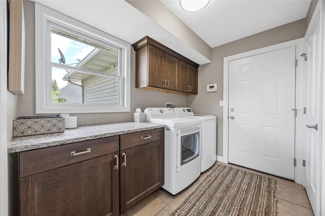 1355 Red Star Rd, Tipton, IA 52772 - laundry area featuring cabinet space, washer and clothes dryer, and light tile patterned flooring