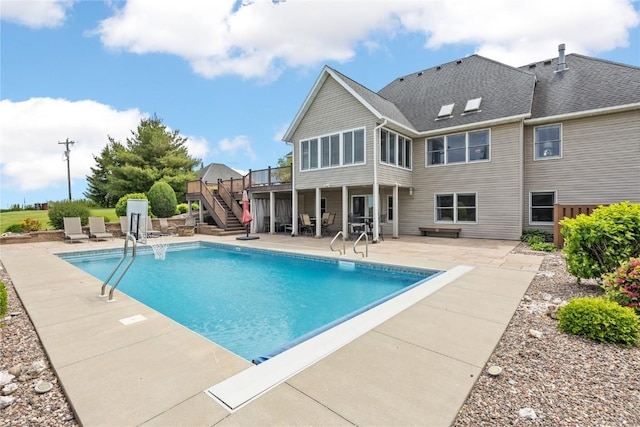 1355 Red Star Rd, Tipton, IA 52772 - outdoor pool featuring stairs, a deck, and a patio area