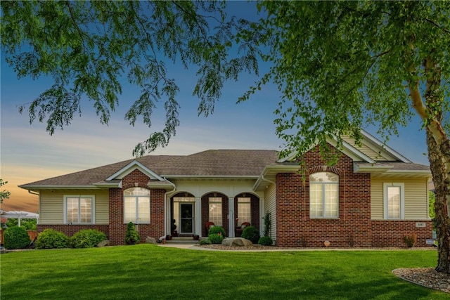 1485 Huntington Hills Dr, Marion, IA 52302 - single story home with a front yard, brick siding, and a shingled roof