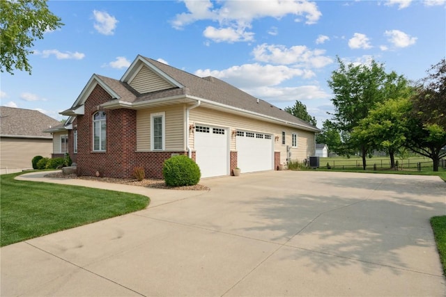 1485 Huntington Hills Dr, Marion, IA 52302 - view of home's exterior with brick siding, concrete driveway, and an attached garage