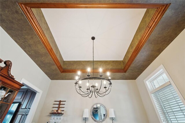 1485 Huntington Hills Dr, Marion, IA 52302 - detailed view of a chandelier, a tray ceiling, and crown molding