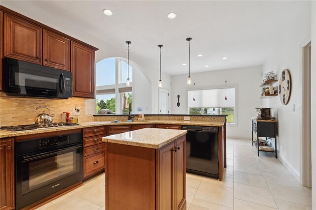 1485 Huntington Hills Dr, Marion, IA 52302 - kitchen featuring black appliances, a sink, tasteful backsplash, light stone countertops, and recessed lighting