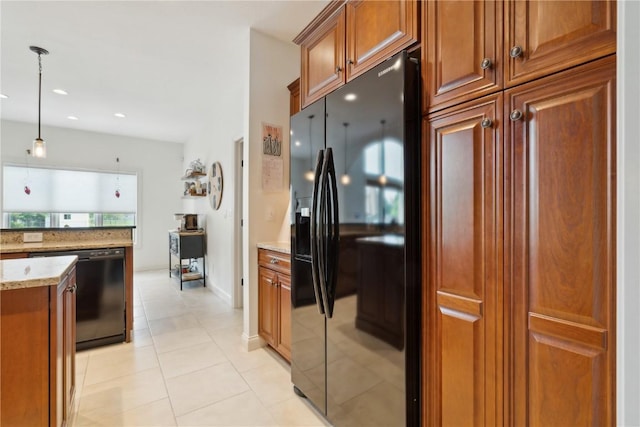 1485 Huntington Hills Dr, Marion, IA 52302 - kitchen with black appliances, light stone counters, decorative light fixtures, brown cabinetry, and light tile patterned floors