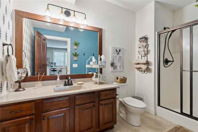 1485 Huntington Hills Dr, Marion, IA 52302 - full bath featuring toilet, a shower stall, vanity, and tile patterned floors