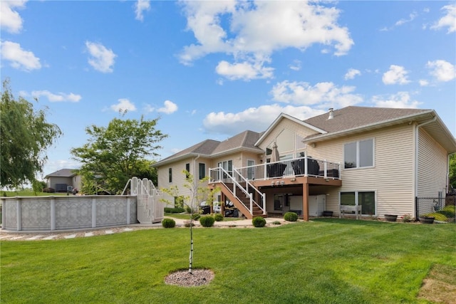 1485 Huntington Hills Dr, Marion, IA 52302 - rear view of house with stairway, a deck, and an outdoor pool