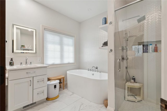 1485 Huntington Hills Dr, Marion, IA 52302 - bathroom featuring a stall shower, a freestanding bath, vanity, and marble finish flooring