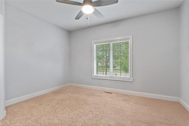 1485 Huntington Hills Dr, Marion, IA 52302 - spare room featuring carpet, baseboards, and ceiling fan