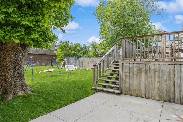5817 Underwood SW, Cedar Rapids, IA 52404 - view of yard with stairs, a playground, a patio, and a wooden deck