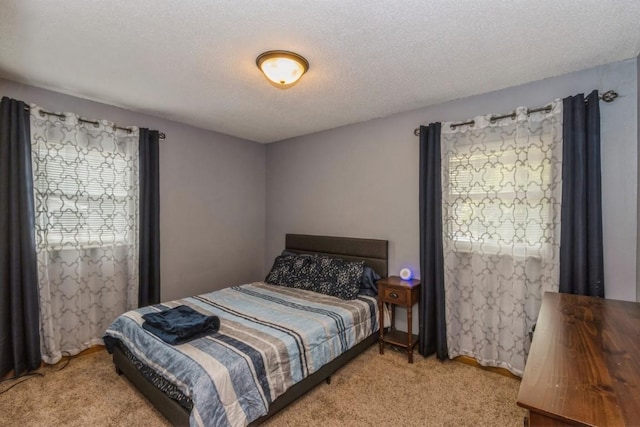 5817 Underwood SW, Cedar Rapids, IA 52404 - bedroom featuring light colored carpet and a textured ceiling