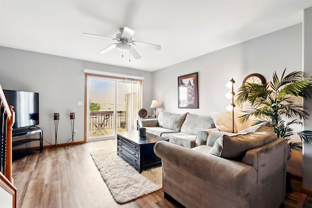2900 Samuel Ct SW Unit D, Cedar Rapids, IA 52404 - living room with ceiling fan and light wood-style floors
