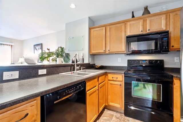 2900 Samuel Ct SW Unit D, Cedar Rapids, IA 52404 - kitchen featuring black appliances, a sink, dark countertops, and recessed lighting
