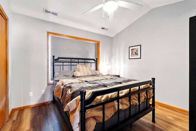 2900 Samuel Ct SW Unit D, Cedar Rapids, IA 52404 - bedroom featuring lofted ceiling, wood finished floors, baseboards, and a ceiling fan