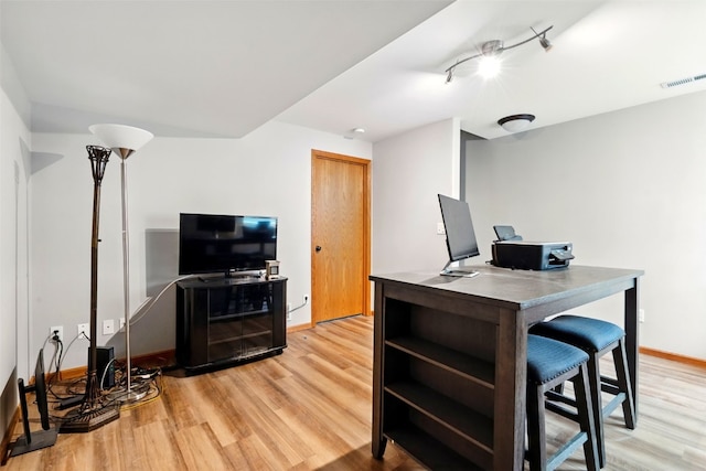 2900 Samuel Ct SW Unit D, Cedar Rapids, IA 52404 - office with light wood-style flooring, baseboards, and rail lighting