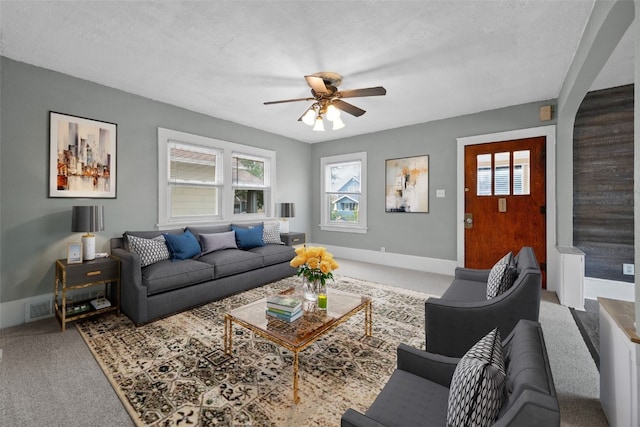 2220 D St SW, Cedar Rapids, IA 52404 - living room featuring carpet flooring, ceiling fan, and baseboards