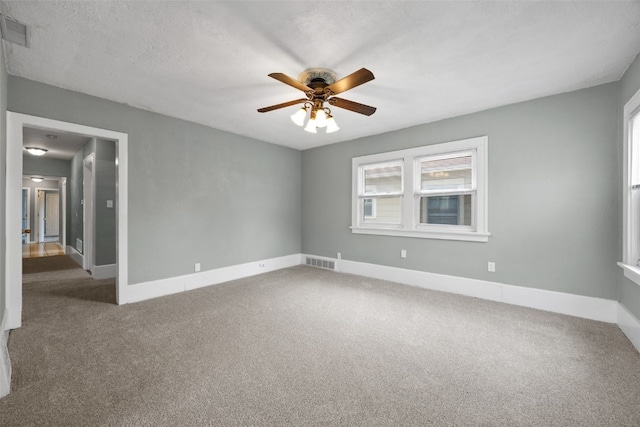 2220 D St SW, Cedar Rapids, IA 52404 - carpeted empty room featuring a ceiling fan and baseboards