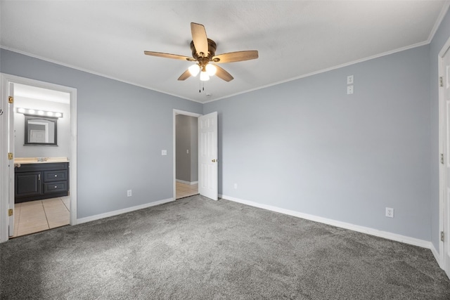 2220 D St SW, Cedar Rapids, IA 52404 - unfurnished bedroom with light colored carpet, baseboards, crown molding, ensuite bath, and ceiling fan