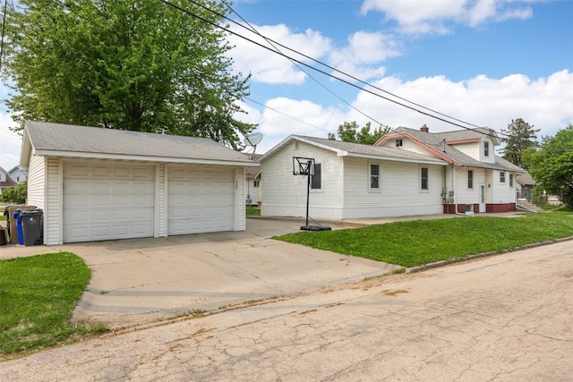 2220 D St SW, Cedar Rapids, IA 52404 - view of front of house with a garage, an outbuilding, and a front lawn