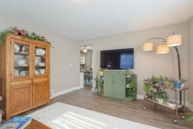 407 7th Ave SW, Cedar Rapids, IA 52404 - entryway with light wood-style floors, a ceiling fan, and baseboards