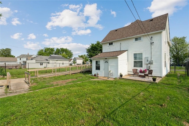 407 7th Ave SW, Cedar Rapids, IA 52404 - back of property featuring a patio area and roof with shingles