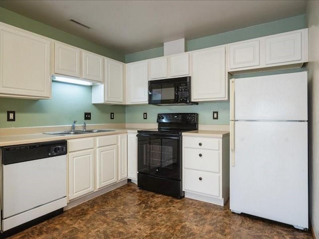 1200 Murray St NE Unit 1, Cedar Rapids, IA 52402 - kitchen featuring black appliances, a sink, white cabinetry, and light countertops