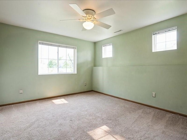 1200 Murray St NE Unit 1, Cedar Rapids, IA 52402 - carpeted spare room with baseboards and a ceiling fan