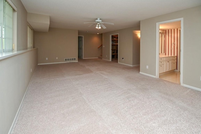 3730 Deer Valley Dr Unit B, Marion, IA 52302 - carpeted spare room with ceiling fan, baseboards, and stairway