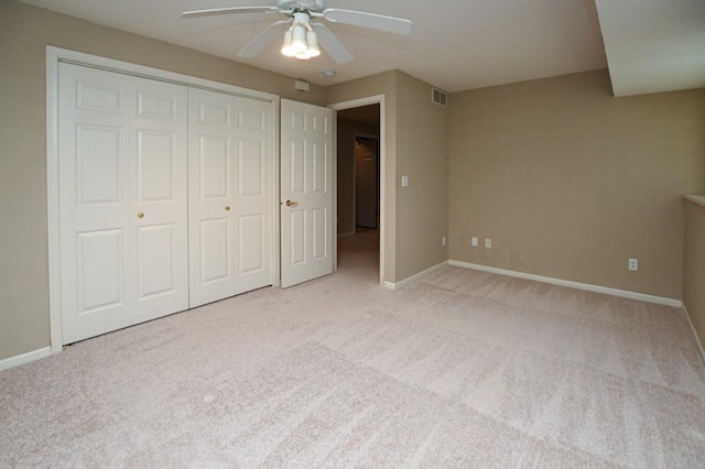 3730 Deer Valley Dr Unit B, Marion, IA 52302 - unfurnished bedroom featuring light colored carpet, baseboards, a closet, and a ceiling fan