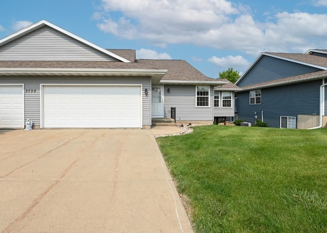 3730 Deer Valley Dr Unit B, Marion, IA 52302 - view of front of house featuring concrete driveway, a front yard, a garage, and a shingled roof