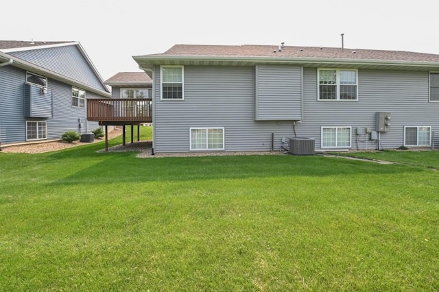 3730 Deer Valley Dr Unit B, Marion, IA 52302 - rear view of house featuring a wooden deck, a yard, and central AC unit