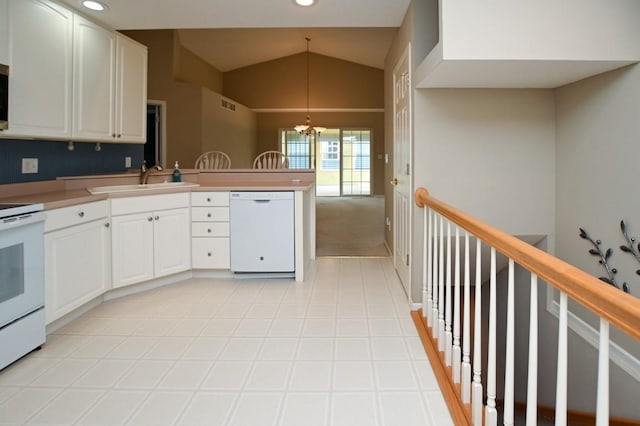 3730 Deer Valley Dr Unit B, Marion, IA 52302 - kitchen with white appliances, a sink, a chandelier, a peninsula, and vaulted ceiling
