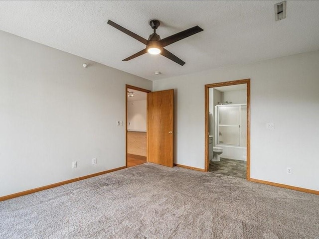 250 Cimarron Dr Unit 122, Hiawatha, IA 52233 - unfurnished bedroom featuring carpet floors, baseboards, ensuite bathroom, a textured ceiling, and ceiling fan