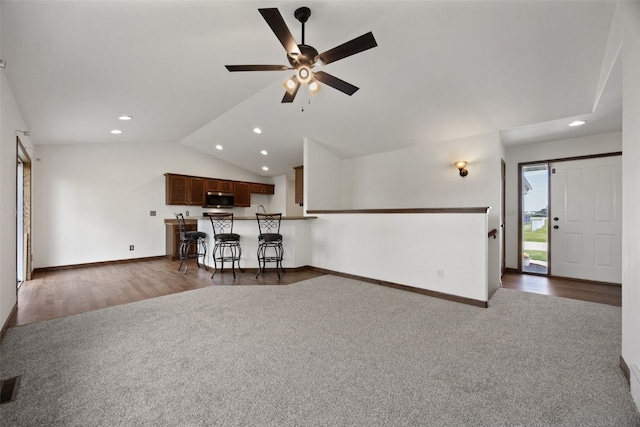 4565 Meadow Creek Dr, Palo, IA 52324 - carpeted living room featuring lofted ceiling, recessed lighting, ceiling fan, and baseboards