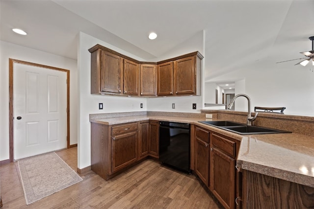 4565 Meadow Creek Dr, Palo, IA 52324 - kitchen featuring black dishwasher, a sink, lofted ceiling, light wood finished floors, and ceiling fan
