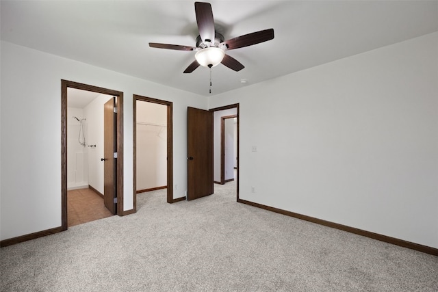 4565 Meadow Creek Dr, Palo, IA 52324 - unfurnished bedroom featuring light colored carpet, a spacious closet, and baseboards