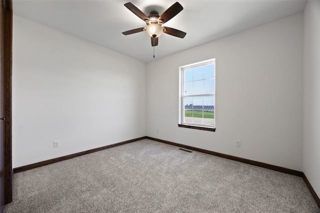 4565 Meadow Creek Dr, Palo, IA 52324 - empty room with carpet, baseboards, and a ceiling fan