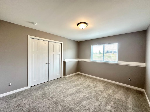 914 Juneberry Dr, Palo, IA 52324 - unfurnished bedroom featuring carpet floors, a closet, and baseboards