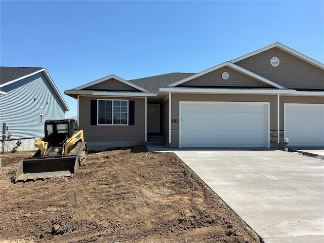 914 Juneberry Dr, Palo, IA 52324 - view of front of home with driveway and a garage