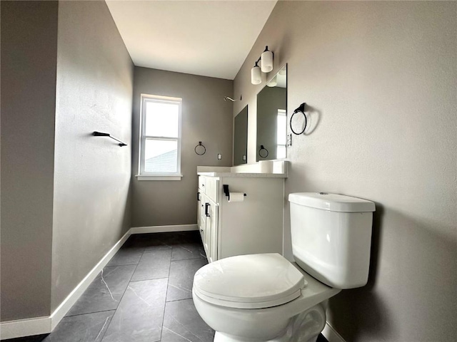 914 Juneberry Dr, Palo, IA 52324 - bathroom with toilet, vanity, and baseboards