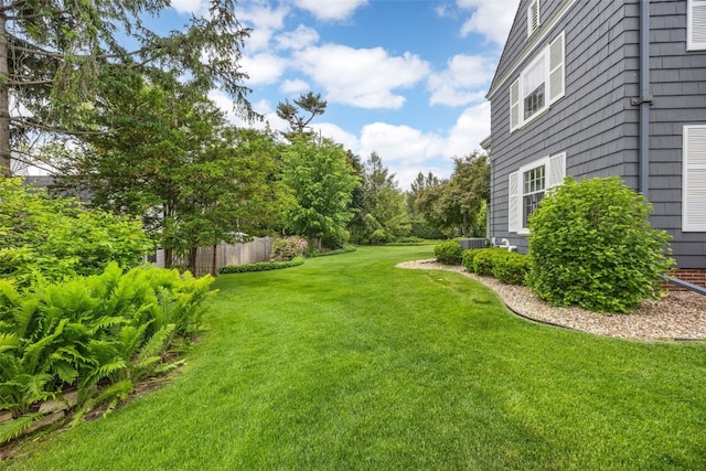 307 Crescent St SE, Cedar Rapids, IA 52403 - view of grassy yard with central AC