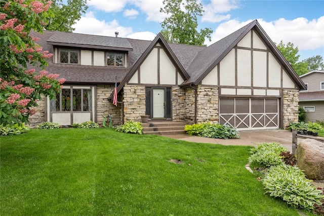 4633 Northwood Dr NE, Cedar Rapids, IA 52402 - tudor home with stone siding, stucco siding, a front lawn, and concrete driveway