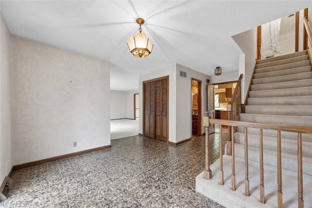 4633 Northwood Dr NE, Cedar Rapids, IA 52402 - foyer entrance featuring baseboards and stairs