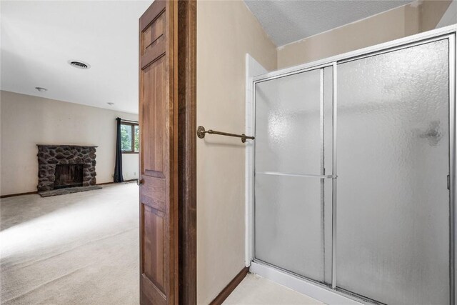 4633 Northwood Dr NE, Cedar Rapids, IA 52402 - bathroom with a shower stall and a stone fireplace
