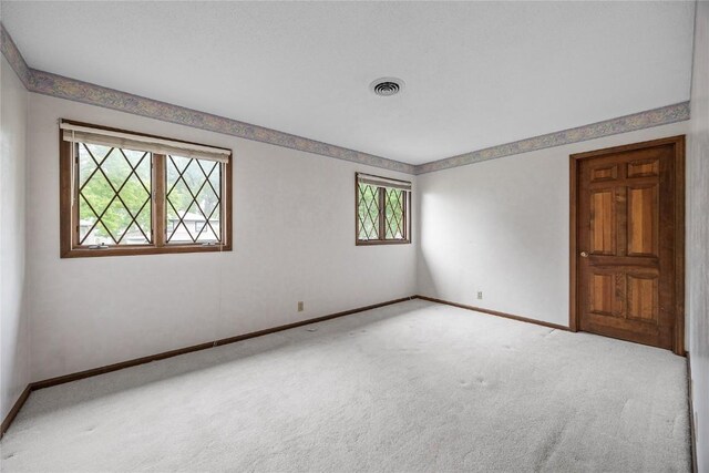 4633 Northwood Dr NE, Cedar Rapids, IA 52402 - spare room featuring carpet floors and baseboards
