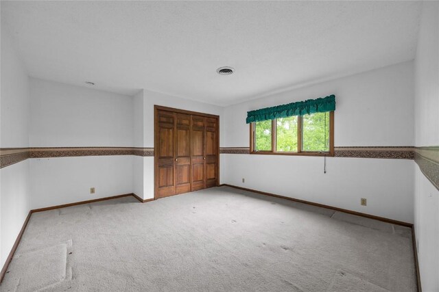 4633 Northwood Dr NE, Cedar Rapids, IA 52402 - unfurnished bedroom with carpet, a closet, and baseboards
