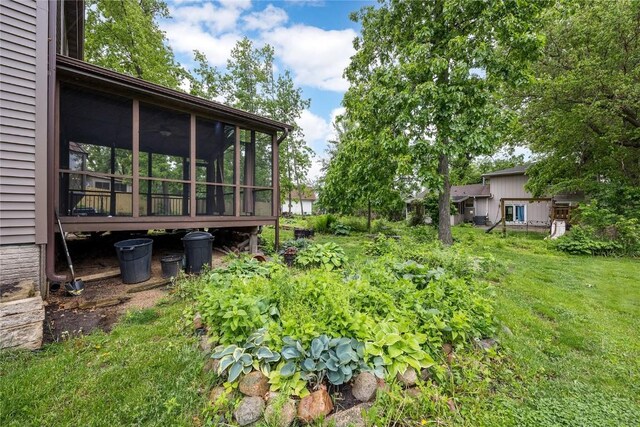 4633 Northwood Dr NE, Cedar Rapids, IA 52402 - view of grassy yard featuring a sunroom
