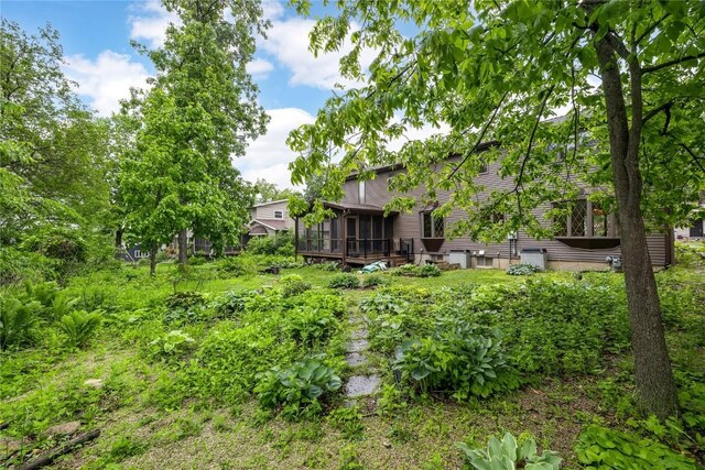 4633 Northwood Dr NE, Cedar Rapids, IA 52402 - view of yard with a sunroom